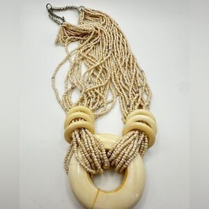 Multi strand glass seed bead and bone/horn pendant!